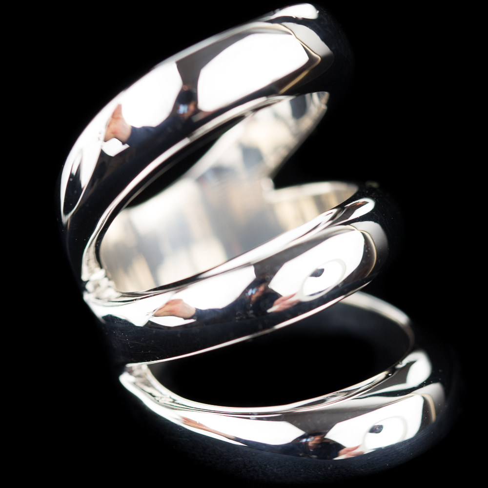 Zilveren ring, blinkend en drie rijen