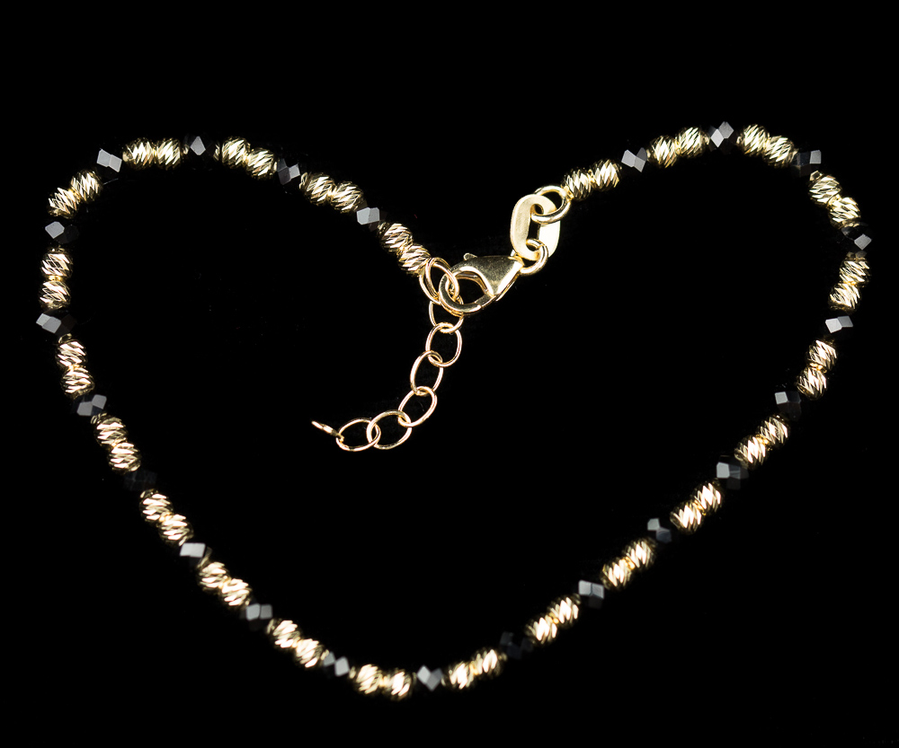 Geel gouden armbandje van 18Kt met onyx